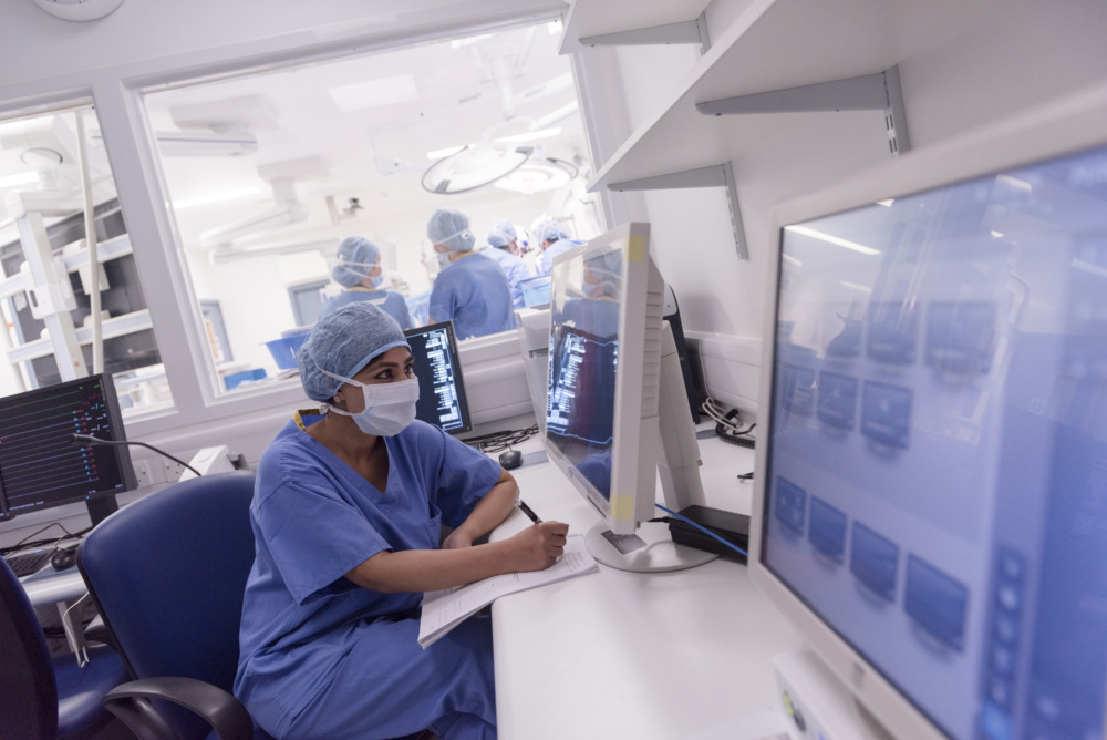 Doctor monitoring a patient during vascular surgery