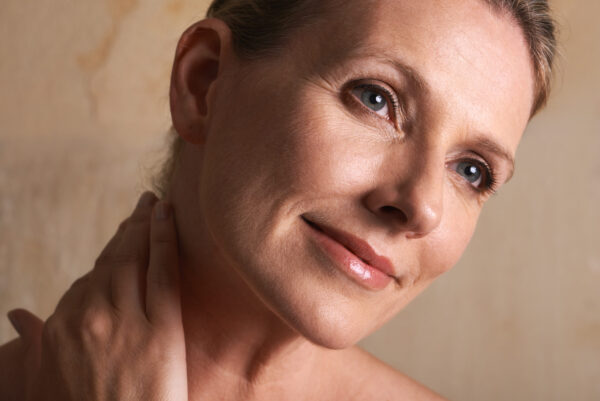 Middle aged woman showing her face skin