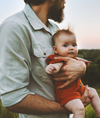 Father walking with baby outdoors family lifestyle dad and child together summer vacations parenthood childhood concept Fathers day holiday